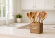 DIY wooden kitchen utensil holder on a rustic farmhouse countertop