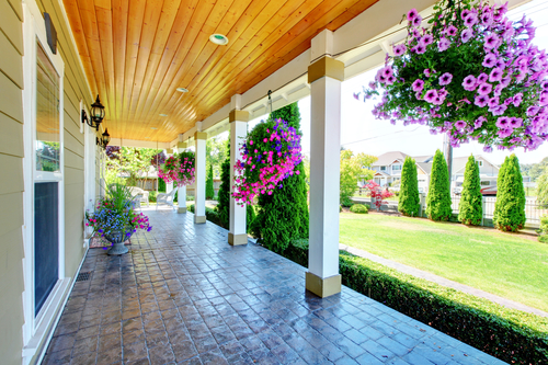 Large luxury porch with beautiful flowers.