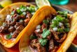 Crispy birria tacos served with chipotle stock, garnished with fresh lime, onions, and cilantro, perfect for an authentic Mexican food experience like taco soup recipe
